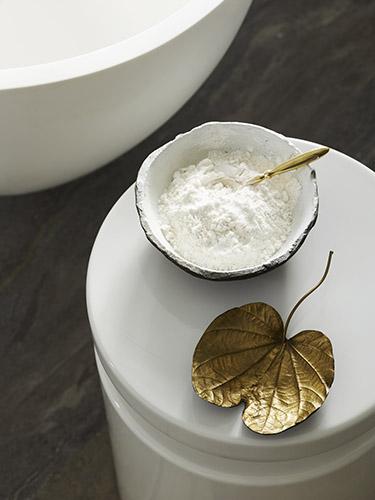 Bathroom styling with bath salt and leaf shaped saucer