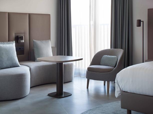 Marriott hotel Amsterdam with BELLE armchair and TRIBE lighting by Maretti