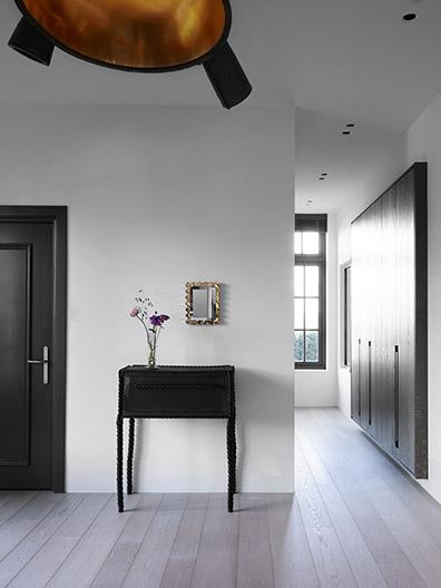 Hallway with sideboard and custom fixed closet / wardrobe